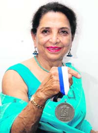 Bhopinder Banta Singh with the silver medal, which she won at the 18th World Masters Athletics Championship, held in Finland