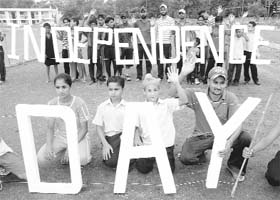 Schoolchildren prepare for the Independence Day celebrations at Yadwindra Stadium in Patiala