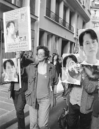 Supporters of Nobel Peace laureate Aung San Suu Kyi during a march near the Myanmar embassy in Paris on Tuesday