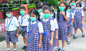 Children at this age would not know why schools have ordered them to wear masks. But it is a simple measure to protect innocent lives from H1N1 virus. Here, children of Adhunik Public School, near Dharamsala, going for their classes- all masked.