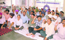 Central excise inspectors hold a protest in support of their demands in Ludhiana on Wednesday. 