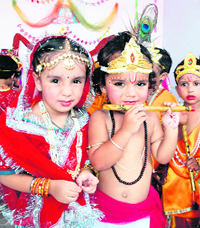 Schoolchildren dress up as Radha and Krishna in Bathinda on Monday.