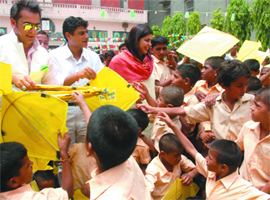 Model and actor Jas Arora distributes kites and strings to hundreds of under-privileged children belonging to Arya Orphanage on the occasion of Independence Day organised by PepsiCo India in old Delhi on Thursday