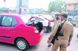 In view of Independence Day, police personnel are seen checking vehicles in Jammu on Thursday.