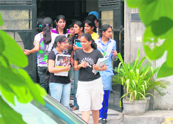 Students come out of a teachers house after attending tuition classes in Ludhiana