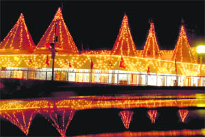A temple illuminated on the occasion of Janmashtami in Sector 24