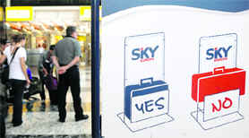 People wait for check-in at a SkyEurope counter at Viennas international airport. The troubled Slovak airline won a grace period untilFriday to pay outstanding invoices after Vienna airport grounded its flight on Tuesday, an airport operator said.