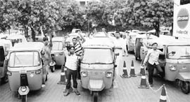 Auto-rickshaw owners protest against non-supply of gas due to technical fault in machinery at an LPG station, Sector 34, in Chandigarh