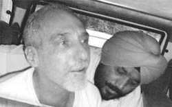 Canadian citizen Milstein in police custody at Dera Bassi.
