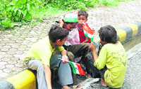 Street children with the national flag in Dehradun.