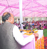 Chief Minister Prem Kumar Dhumal addressing a huge public meeting at Indora after dedicating a college building on Friday.