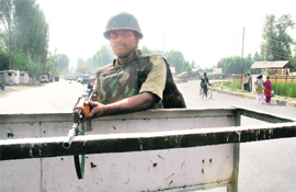 A CRPF jawan maintains a strict vigil at Parampora, the main venue for I-Day celebrations, in Srinagar on Friday. 