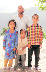 Girdhari Lal with his children at Saili village in Bani tehsil of Kathua district. 