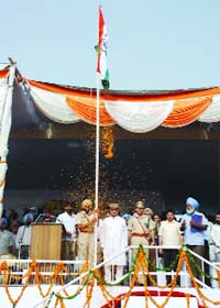 Tikshan Sud, a cabinet minister, unfurls the national flag during an Independence Day function held at the Sports Stadium in Bathinda
