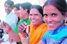 Women allottees show keys of their flats druing the inauguration of a housing complex at Sector 38 (West), Chandigarh, on Saturday.