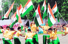 Patriotic fervour: Students carry Tricolours during the Independence Day function in Chandigarh on Saturday.