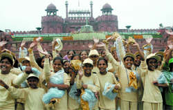 Schoolchildren enjoy the Independence Day programme at the Red Fort in New Delhi on Saturday. 
