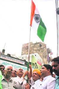 Members of the Central University Andolan Samiti celebrate Independence Day at City Chowk in Jammu