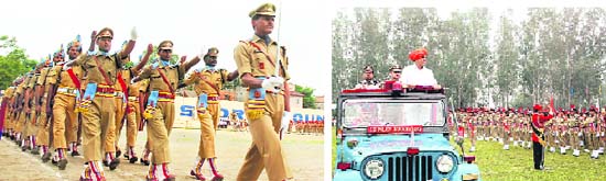 CRPF personnel take part in the march past at the Independence Day function in Jammu on Saturday; and (above) RS Chib, Minister for Medical Education, take the salute at Udhampur