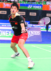 China Lin Dan returns a shot against Indonesias Sony Dwi Kucoro on Saturday. 
