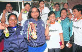 Winners pose with their medals during the 35th Men and 27th Women Senior Powerlifting Championship in Chandigarh
