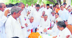 Parliamentary Secretary Dura Ram listens to the grievances of people in a village in Fatehabad on Sunday.