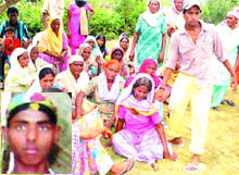The wailing family members of Rakesh (inset) at Mandal Himmat village in Nurmahal on Sunday.