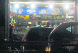 Youths at a liquor vend in Ludhiana. 