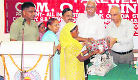 ON Bindroo, president, All-India SBI Staff Federation, donates sewing machines and utensils among the needy.