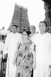 Reliance Anil Dhirubhai Ambani Group chairman Anil Ambani (right), his mother Kokilaben and Industrialist T Kannan come out of the Meenaxi Temple in Madurai on Sunday.