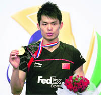 Chinas Lin Dan poses with the winners medal in Hyderabad on Sunday.  AFP