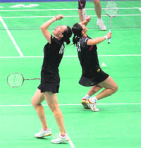 Chinas Zhao Tingting (L) and Zhang Yawen celebrate after winning the womens doubles final against Cheng Shu and Zhao Yunlei, also of China, on Sunday.  PTI