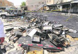 Burnt debris after a fire broke out at a wedding tent in Kuwait City, Kuwait, on Saturday.