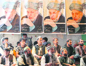 Afghans attend an election rally in support of Afghanistans President Hamid Karzai, who is seeking a second term in the countrys upcoming presidential election, in Kandahar on Sunday. The elections will take place on August 20. 
