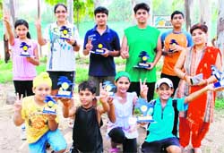 Winners of Sh LD Kapoor Memorial Total Tennis Championship with their trophies at the YMCA, Sector 11, in Chandigarh 