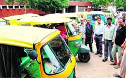 Auto drivers gather at the office of the STA in Sector 18 to lodge their protest in Chandigarh