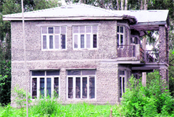 A decaying building of the forest rest house at Indora that has been awaiting inauguration due to non-availability of furniture.