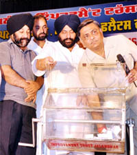 Cabinet minister Manoranjan Kalia conducts a draw of lots for LIG flats in Jalandhar.