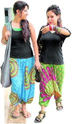 These girls make a fashion statement in their floral harem pants and black tees