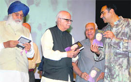 (From left) Chief Minister Parkash Singh Badal, Opposition Leader LK Advani, BJP leader Balramji Das Tandon and his son Sanjay Tandon at a book release function in Chandigarh on Monday.