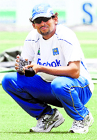 Sri Lankas Tillakaratne Dilshan squats during a practice session ahead of their first Test against New Zealand in Galle on Monday.