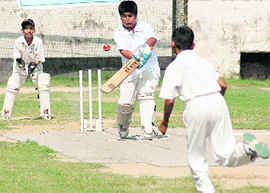 A batsman of St Xaviers, Sector 44, plays a shot at Shivalik Public School in Sector 41, Chandigarh, on Tuesday. 
