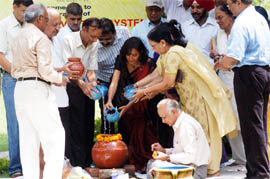 Coca-Cola India and Agro Foods partner with members of an NGO and a Residents Welfare Association launch a rainwater harvesting project at HOPE Apartments in Gurgaon on Tuesday.
