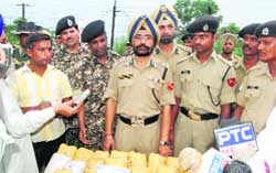 Himmat Singh, IG, BSF, Punjab, and other officials with the packets of heroin seized from Bohar Wadala village in Gurdaspur