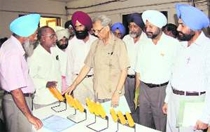 PAU Vice-Chancellor Manjit Singh Kang and Joint Director (Agriculture) Nirankar Singh during a workshop in Ludhiana. 
