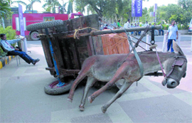 An exhibit by artist G.R. Iranna made of wood, fibreglass, metal, leather and rubber tyres on display at the ongoing India Art Summit 2009 at Pragati Maidan in New Delhi on Thursday. 
