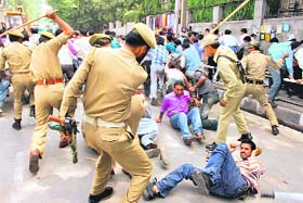 Cops lathicharge dailywagers of the Power Development Department protesting in Srinagar in support of their demand for regularisation