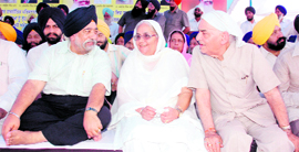Bibi Surjit Kaur Barnala, wife of the TN Governor, flanked by Paramjit Singh Sarna (left), DSGMC chief, and BJP leader Madan Lal Khurana at a function at Longowal village on Thursday.