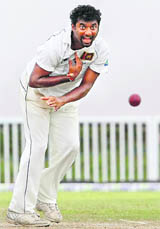 Sri Lankas Muttiah Muralitharan bowls on the third day of their first Test against New Zealand in Galle on Thursday.
