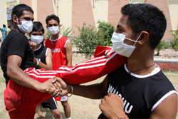 Swine flu scare haunts wushu players from Jalandhar. The participants were seen wearing masks while taking part in a practice session at the DAV College in Bathinda on Friday. 